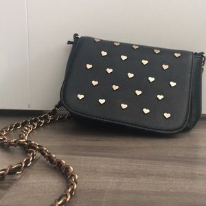 Black purse with gold hearts